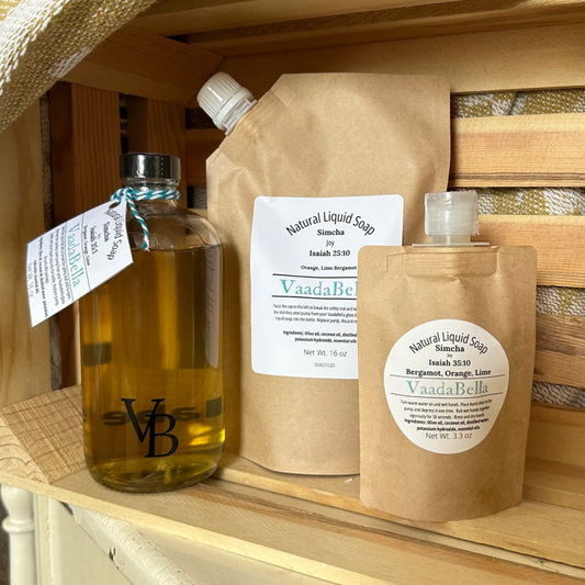 Glass bottle, refill pouch and travel size pouch of Simcha liquid hand soap. Scent: orange lime bergamot