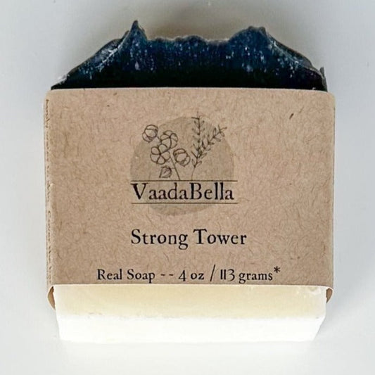 white bottom, black top bar with kraft paper product sleve centered on bar.  Black ink prints the brand logo, "Strong Tower" and "Real Soap -- 4 oz / 113 grams*"