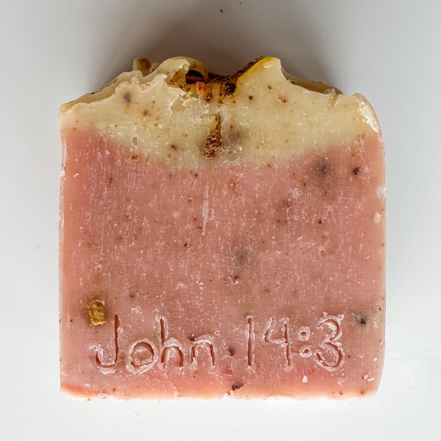 pink bottom, light yellow topped bar, citrus zest sprinkled throughout.  John 14:3 etched in the front