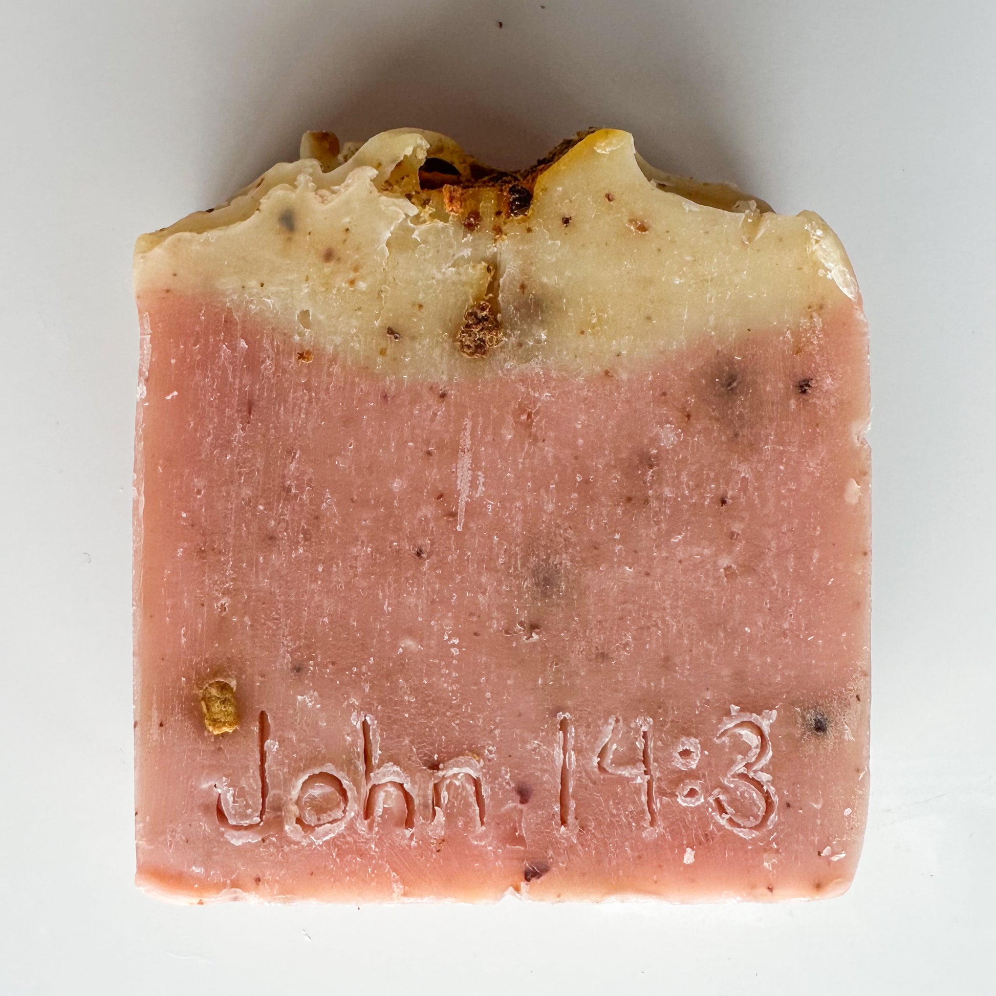 pink bottom, light yellow topped bar, citrus zest sprinkled throughout.  John 14:3 etched in the front