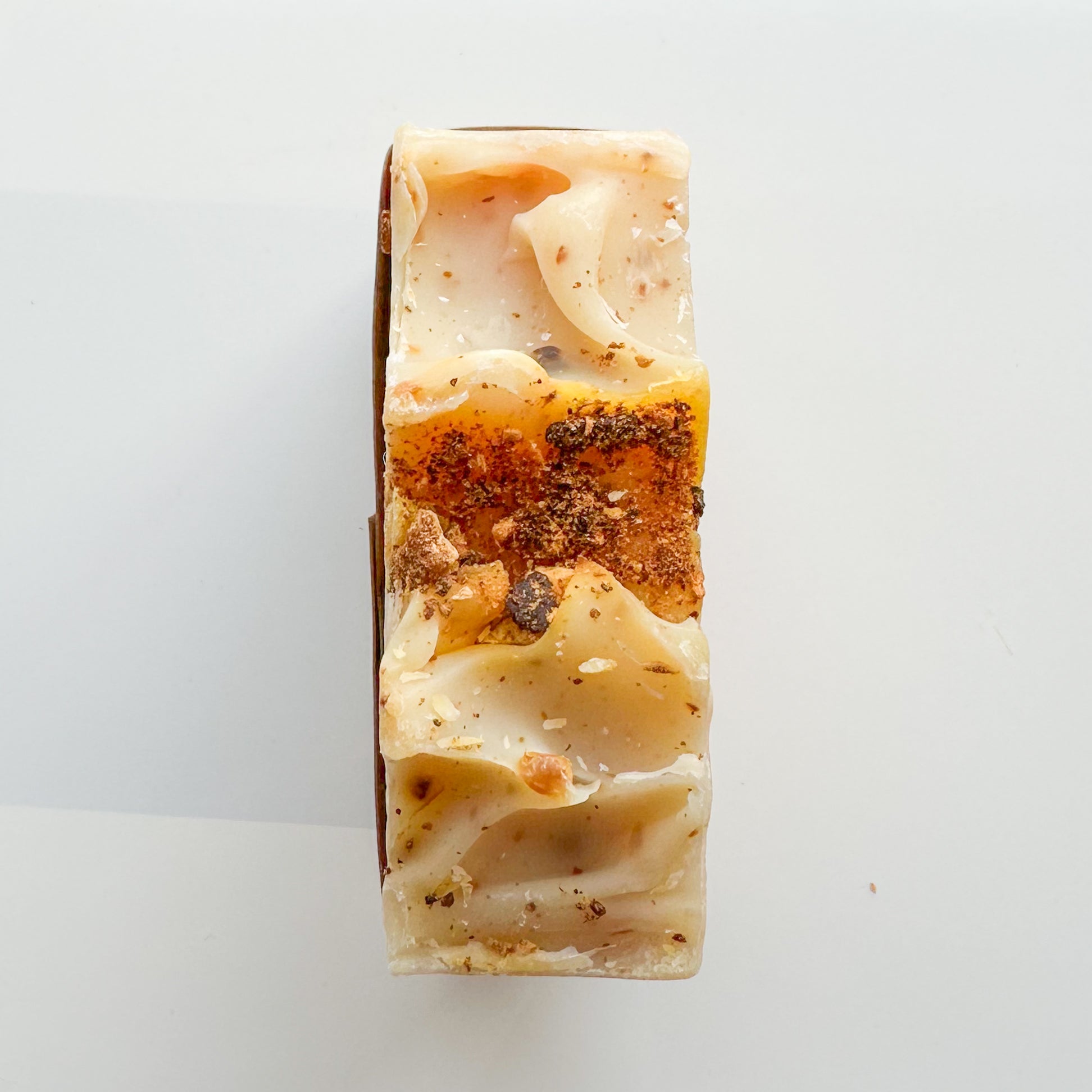 Light yellow bar top with two waves toward the middle.  Between the waves, citrus zest