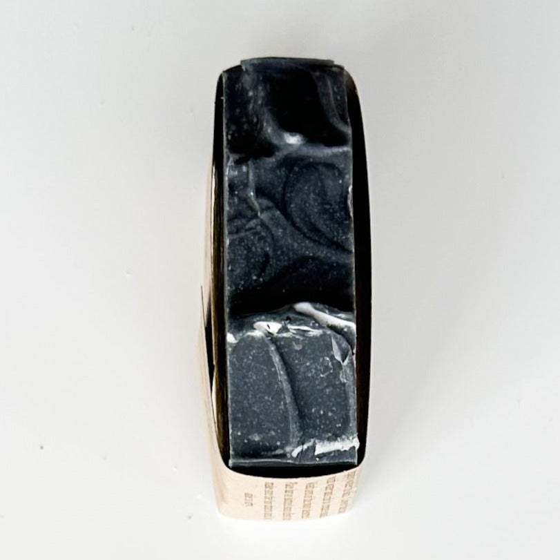 Black bar top with two waves/peaks at the center of the bar.  Bird's-eye view.